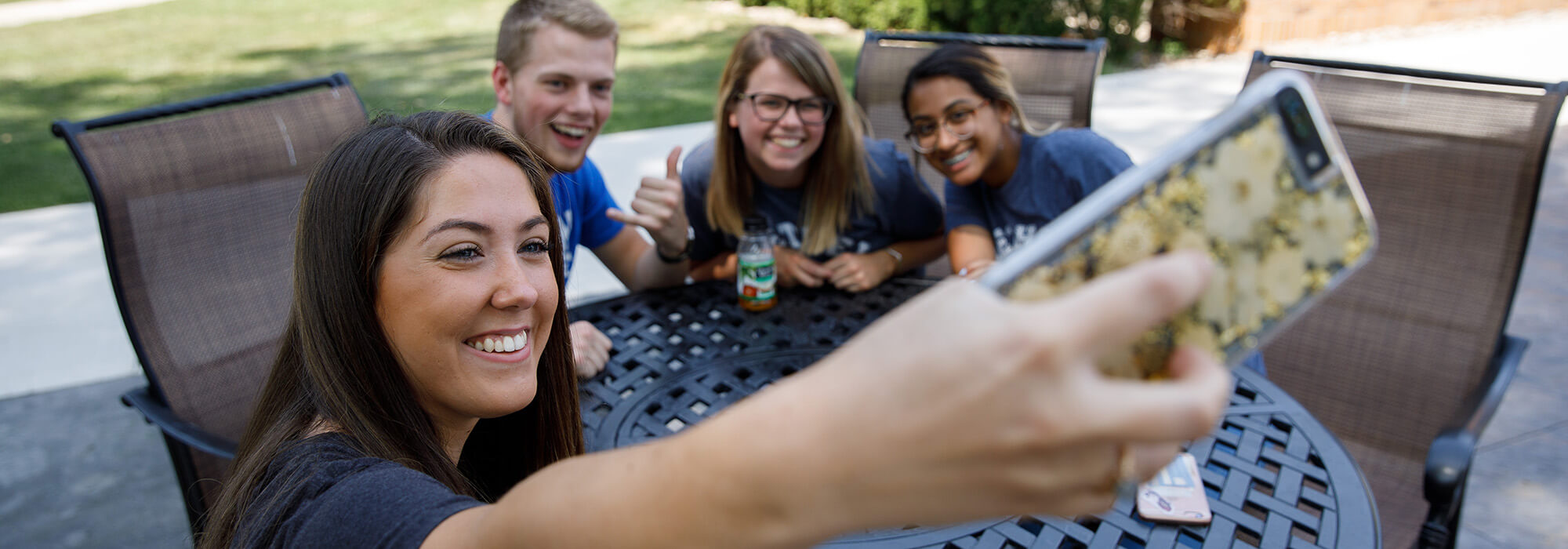 students taking a selfie and laughing